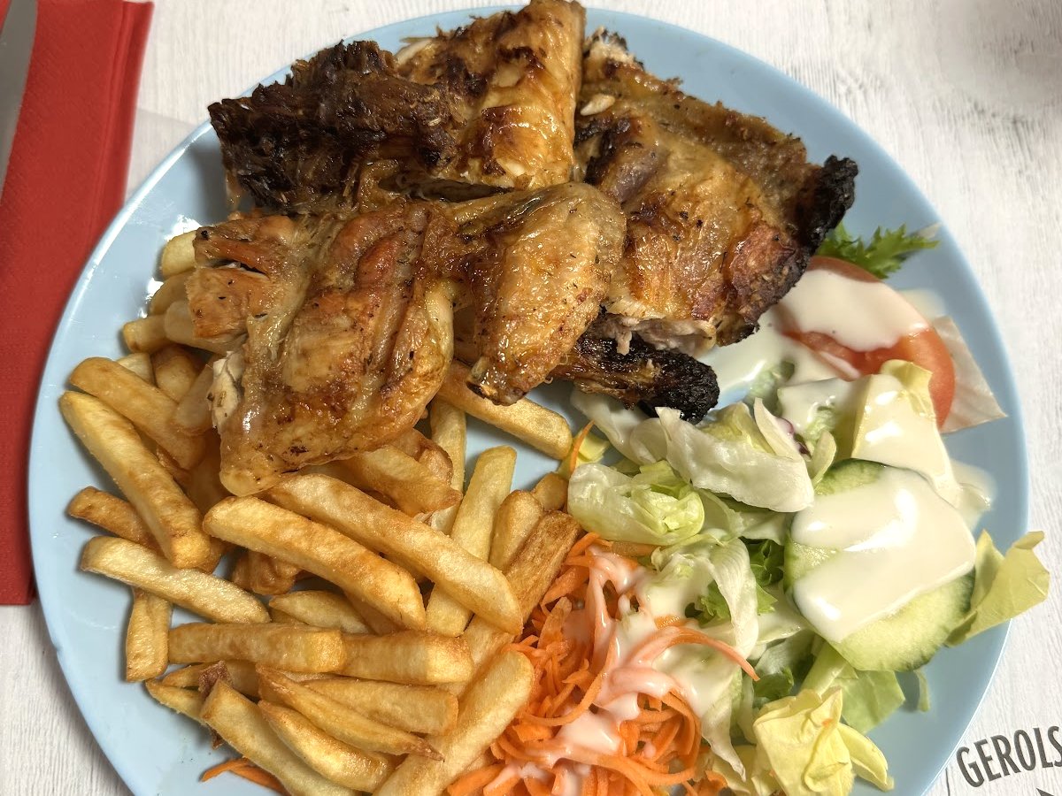 Grilled chicken and fries, a simple plate served at La Poste